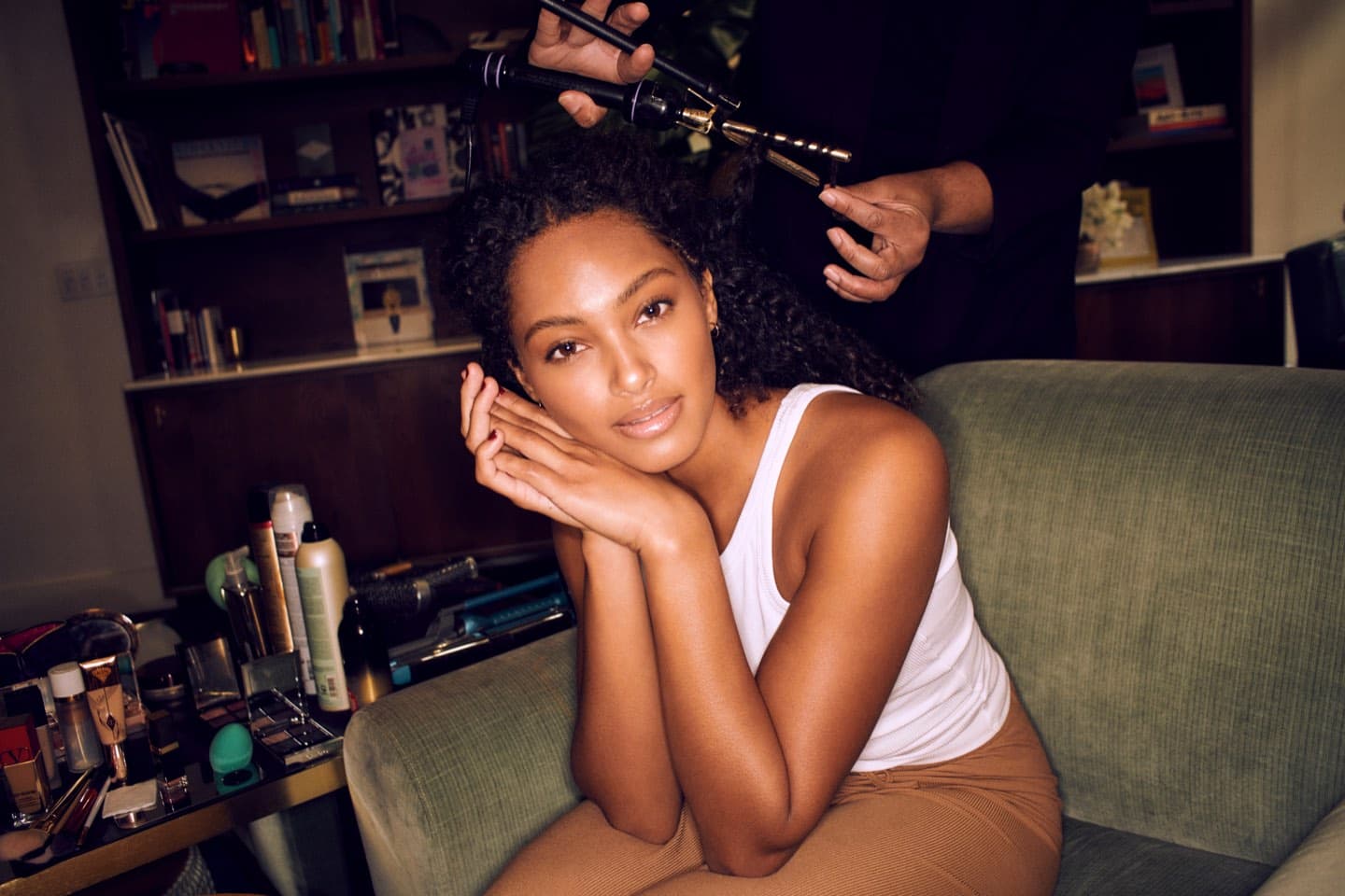 A GLAMSQUAD client having her hair styled at home